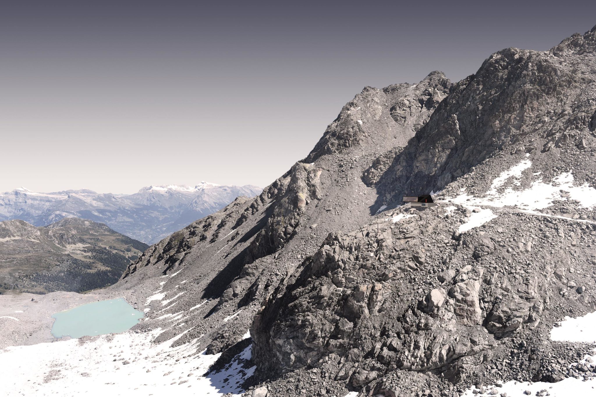 A solitary cabin high up in a mountain with a view of a small pond down in the valley.